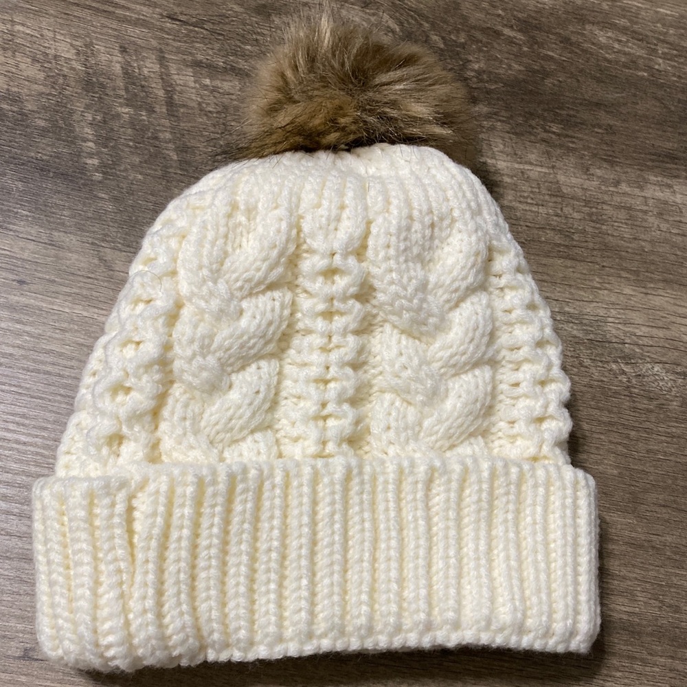 White beanie with fur ball